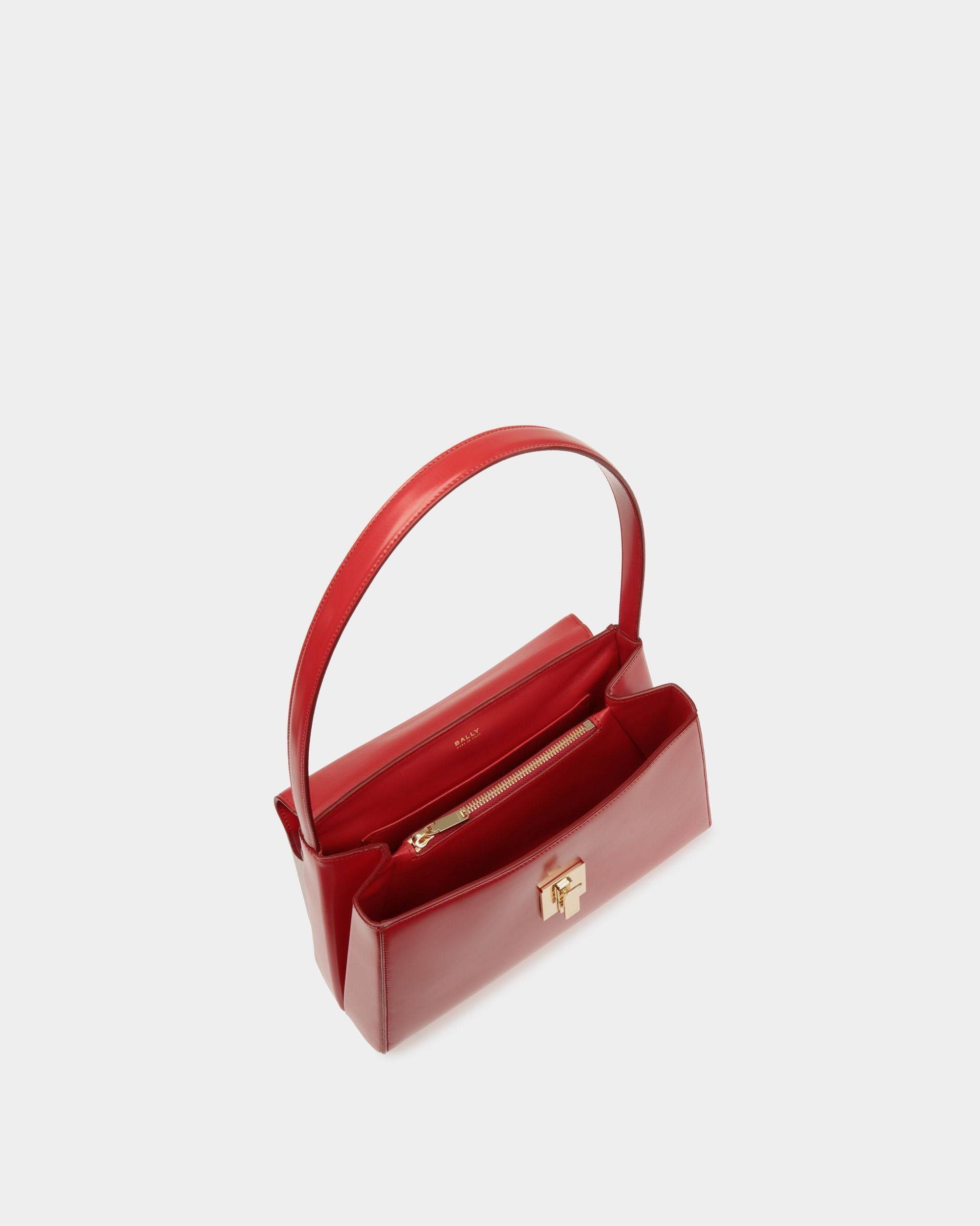Ollam | Women's Shoulder Bag in Candy Red Brushed Leather | Bally | Still Life Open / Inside