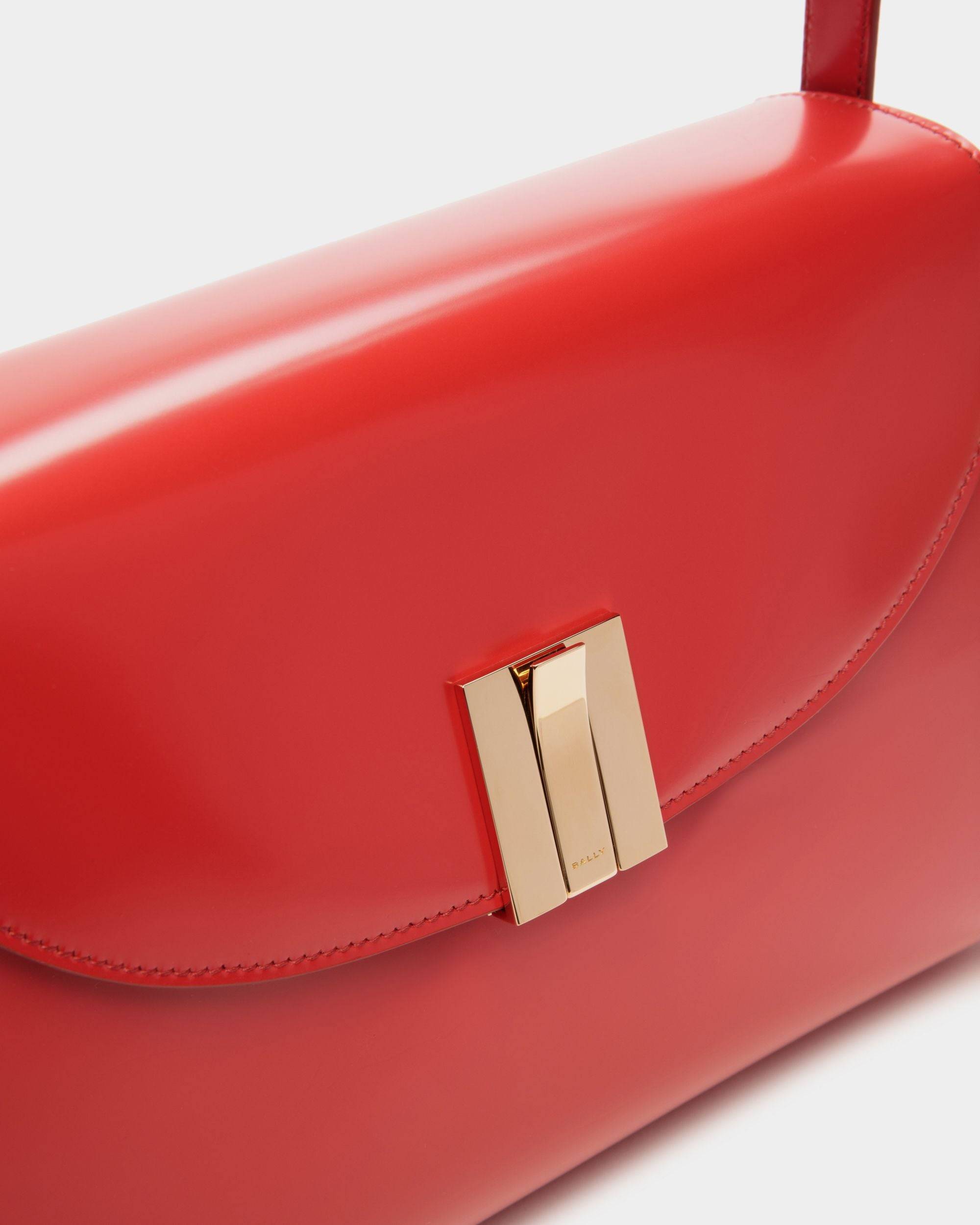 Ollam | Women's Shoulder Bag in Candy Red Brushed Leather | Bally | Still Life Detail