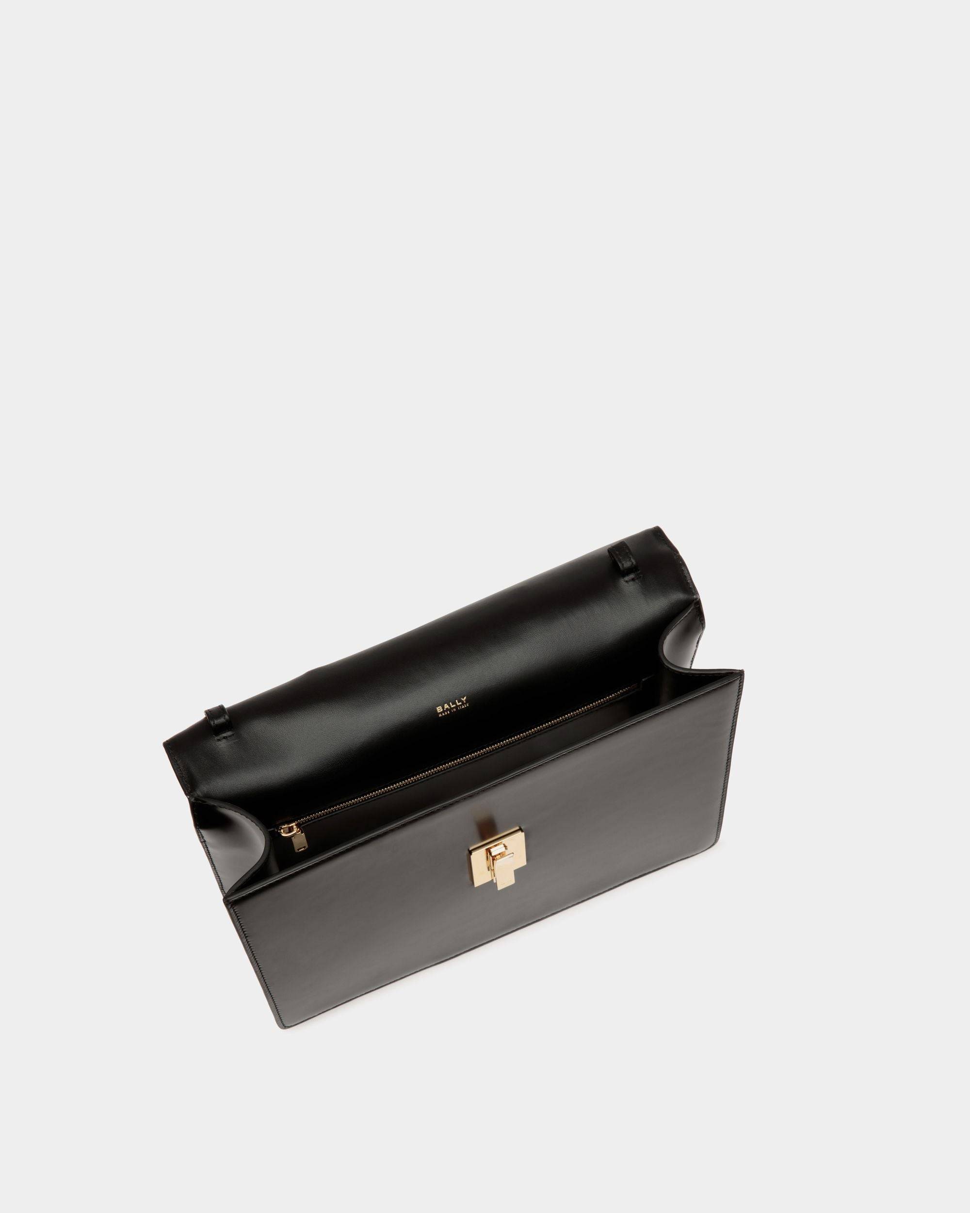 Ollam | Women's Top Handle Bag in Black Brushed Leather | Bally | Still Life Open / Inside