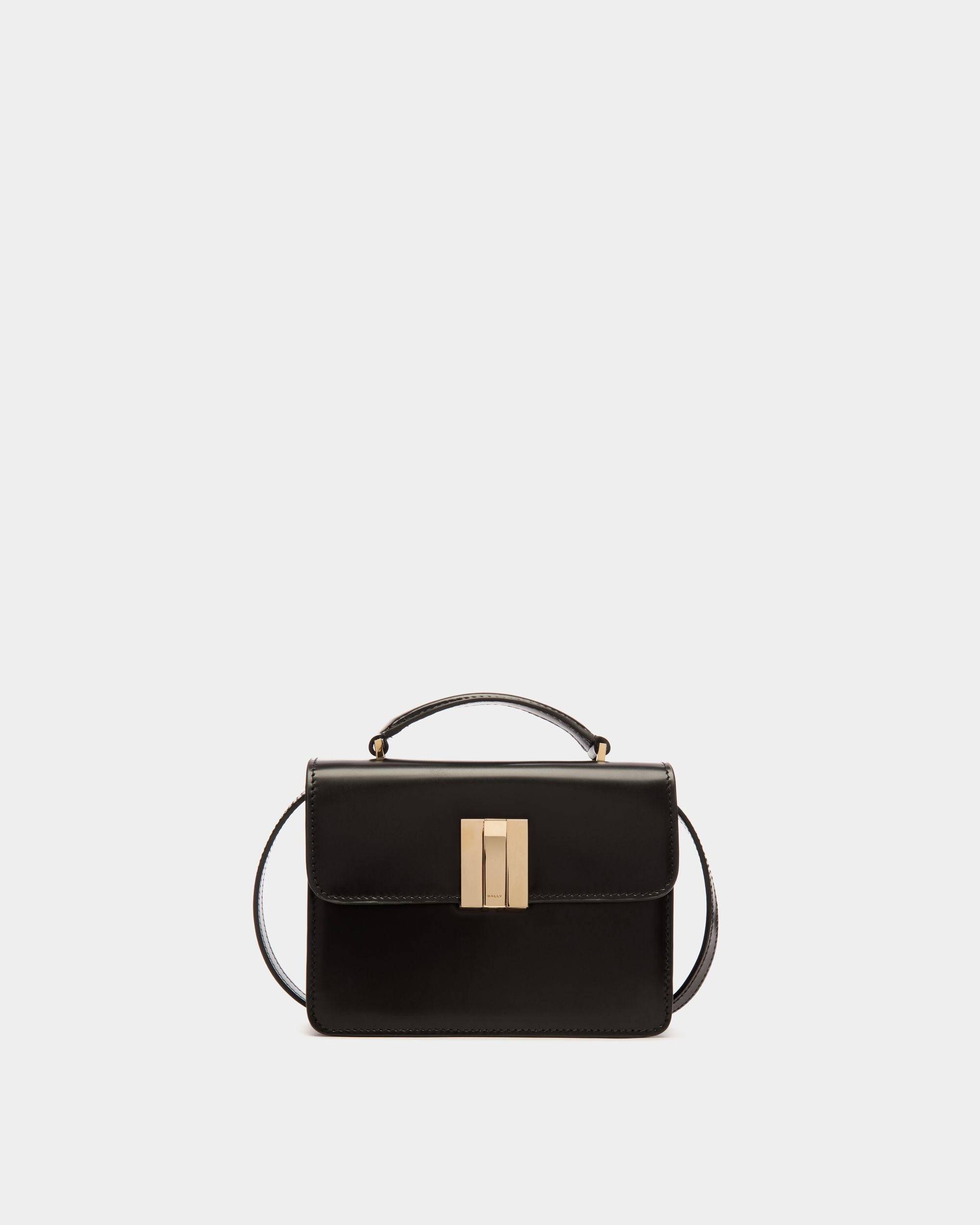 Ollam | Women's Mini Top Handle Bag in Black Brushed Leather | Bally | Still Life Front