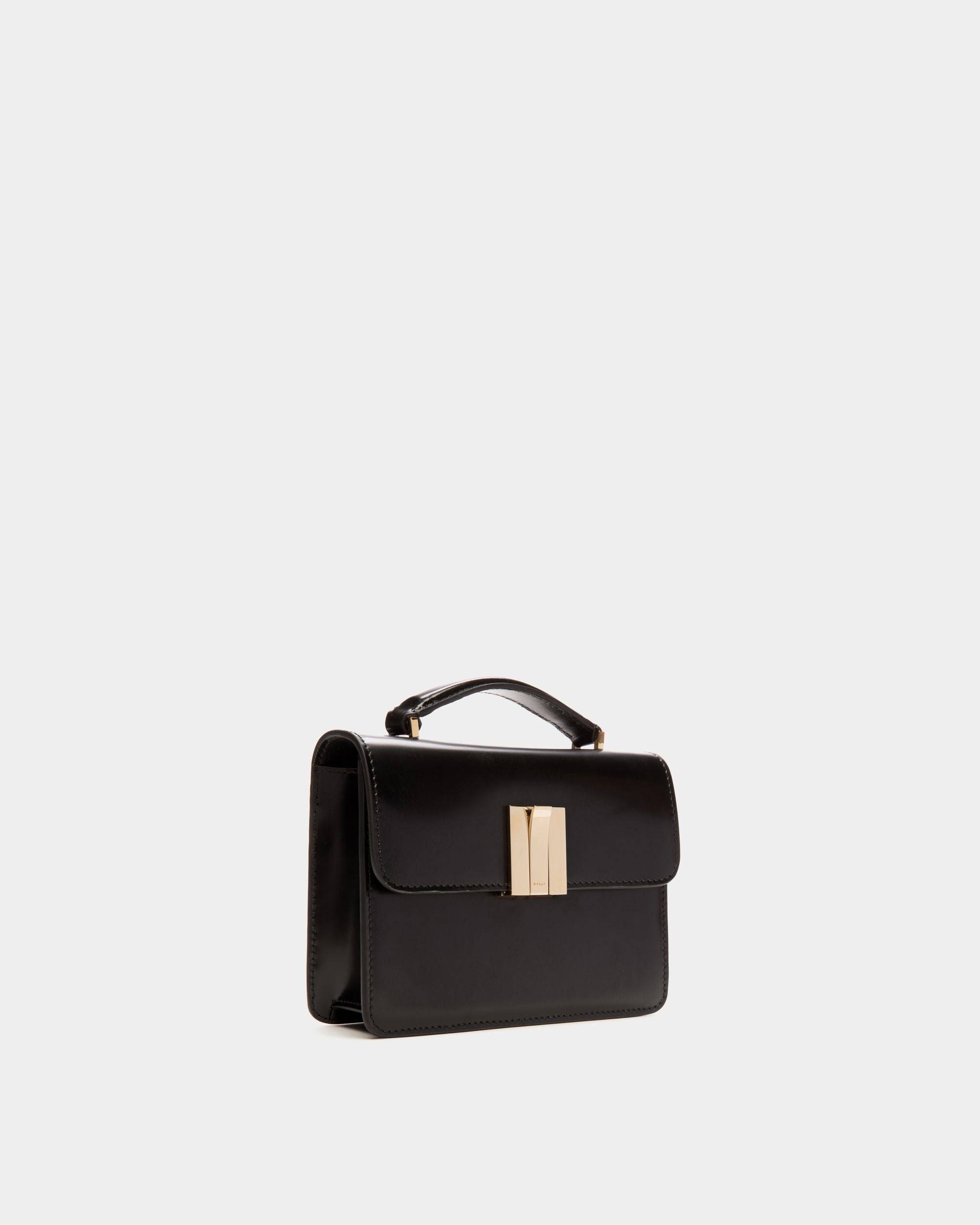 Ollam | Women's Mini Top Handle Bag in Black Brushed Leather | Bally | Still Life 3/4 Front