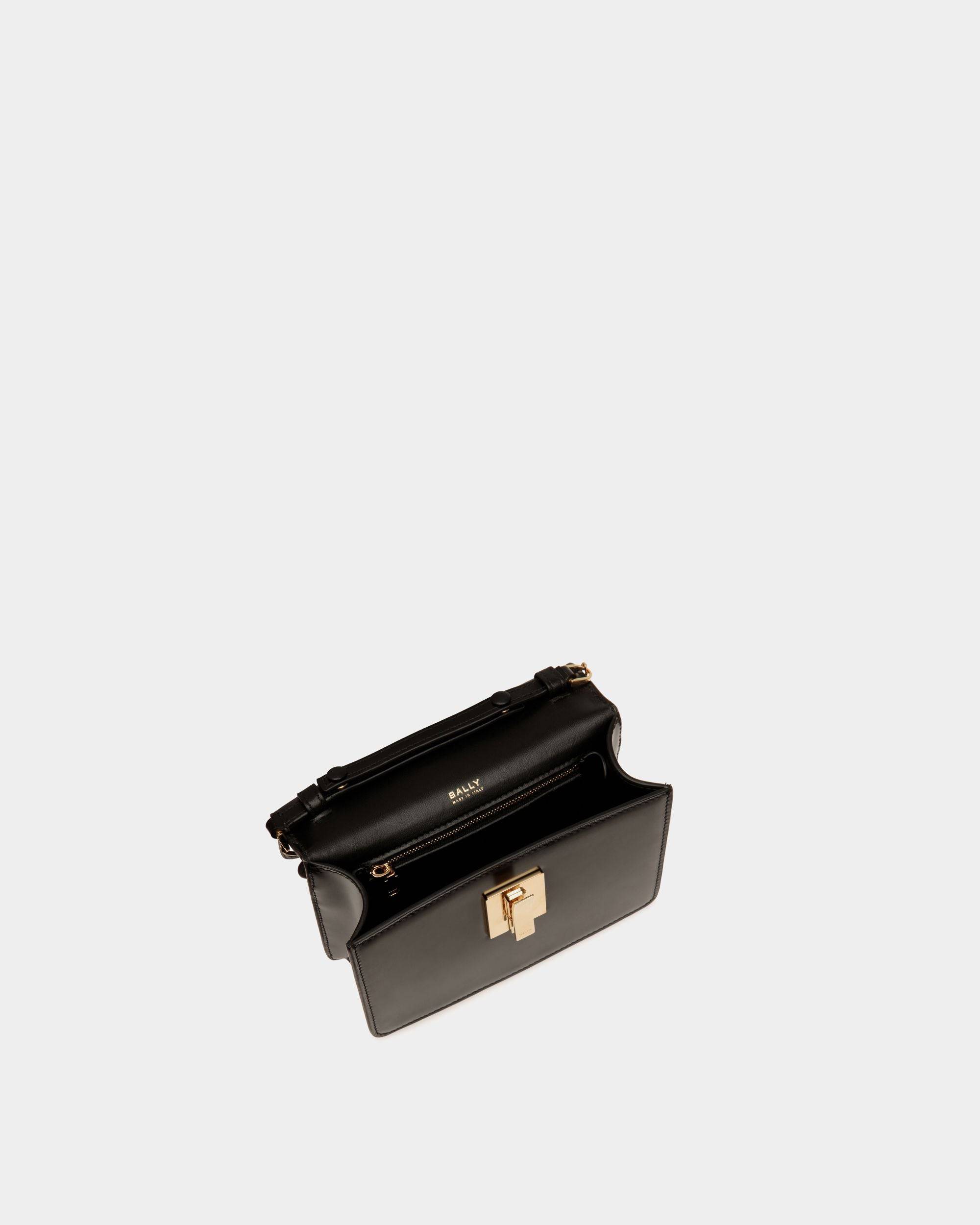 Ollam | Women's Mini Top Handle Bag in Black Brushed Leather | Bally | Still Life Open / Inside