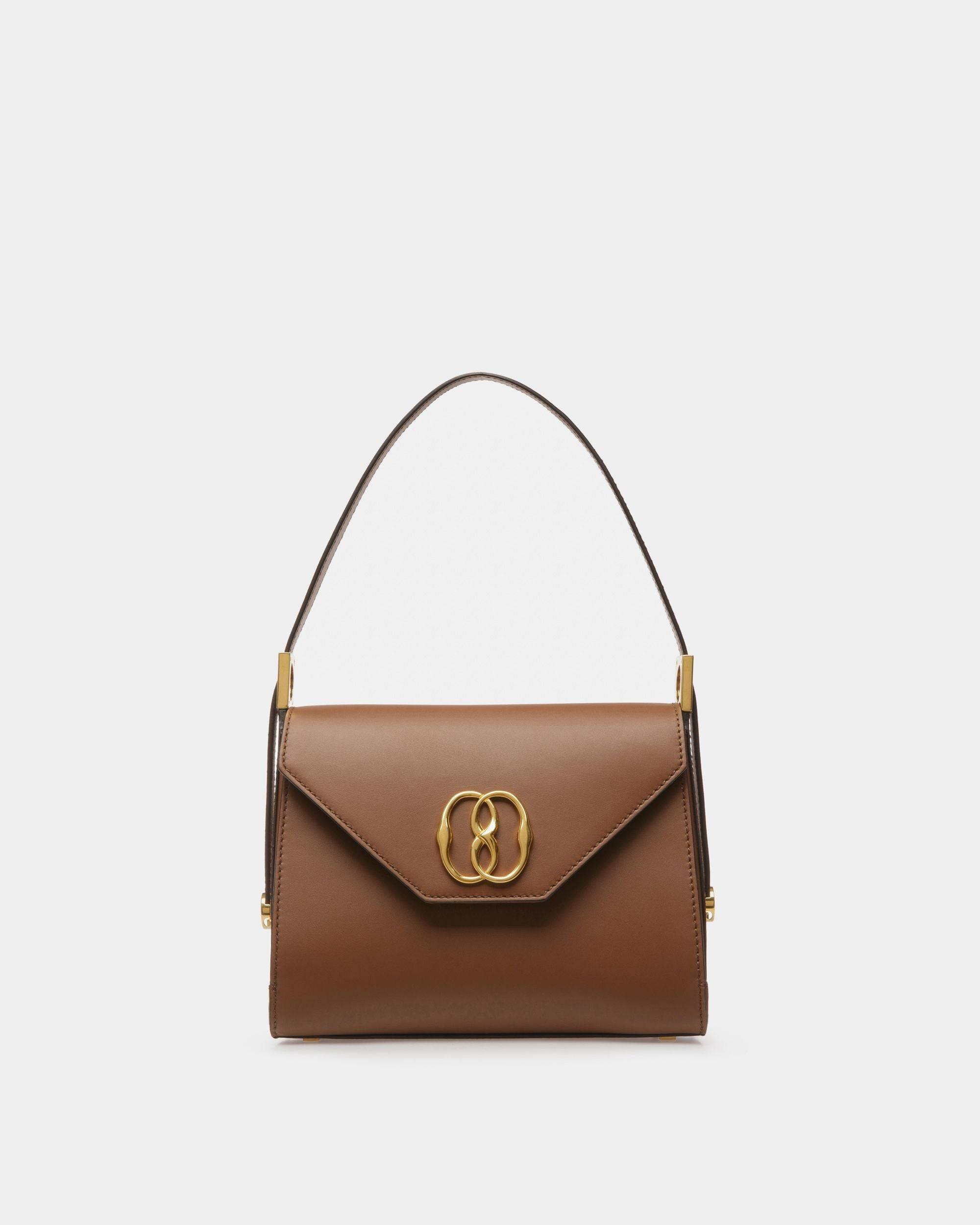 Emblem Trapeze | Women's Top Handle Purse | Brown Leather | Bally | Still Life Front