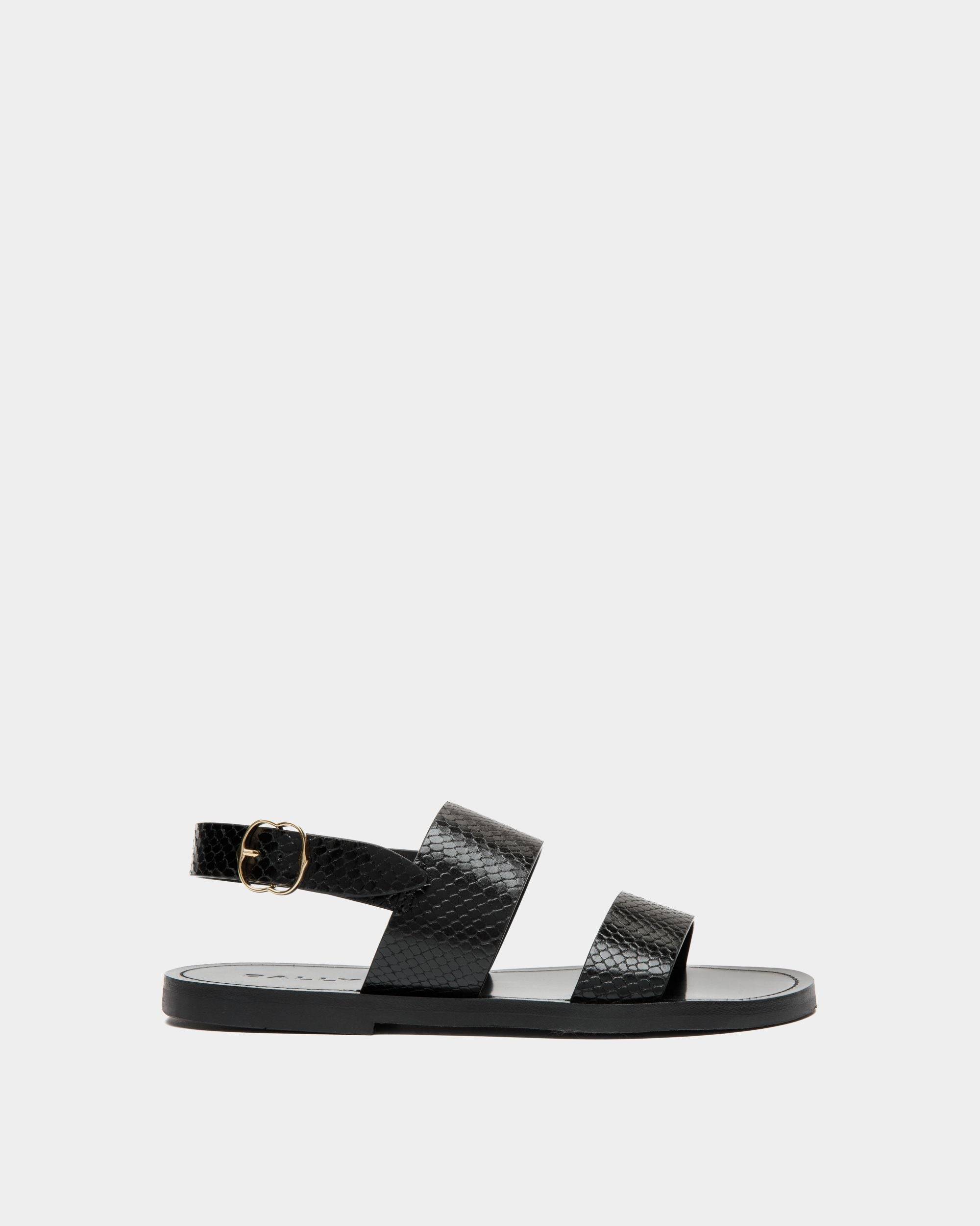 Baudy | Women's Flat Sandal in Black Python Printed Leather | Bally | Still Life Side