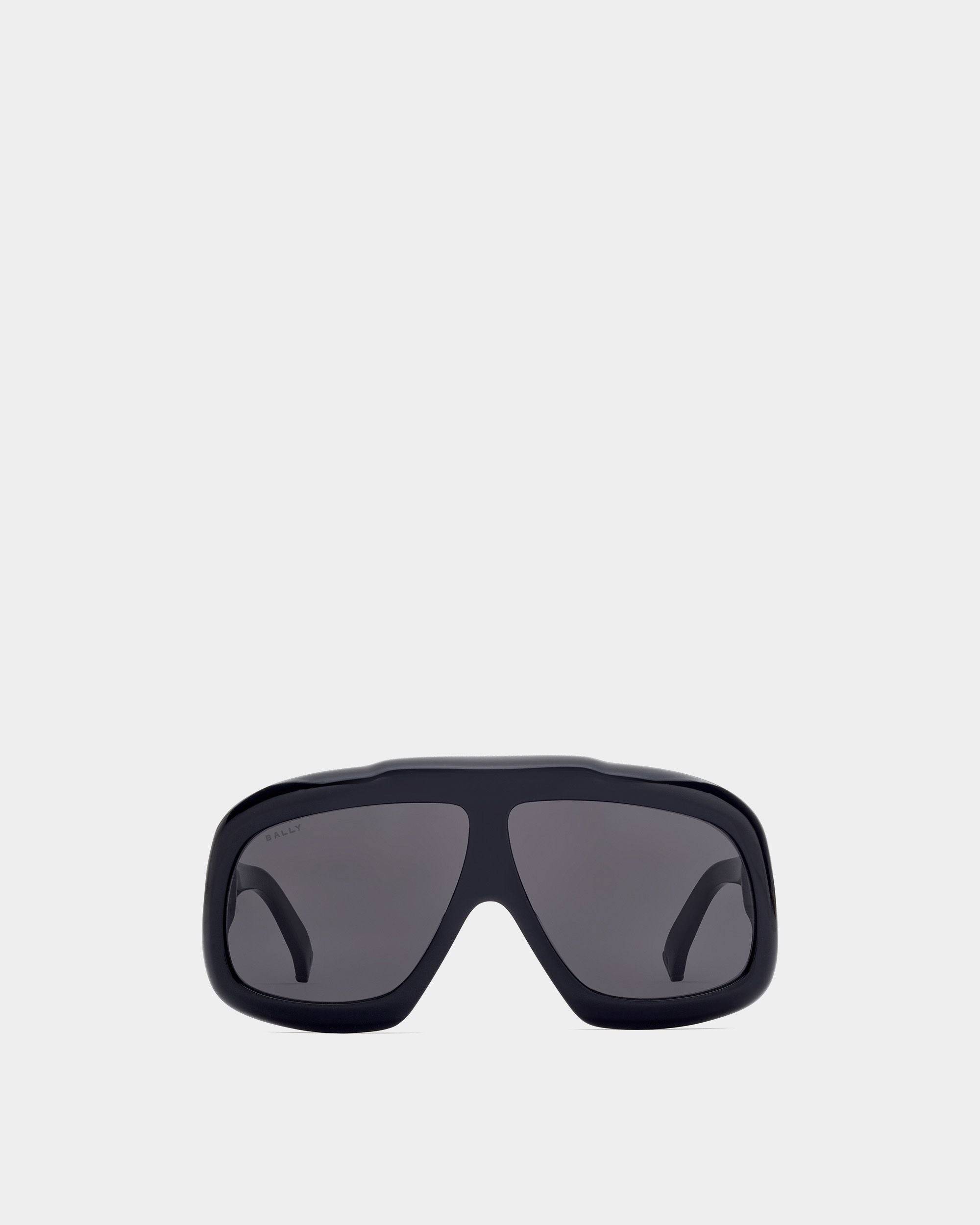Eyger Sonnenbrille | Unisex-Accessoires | Schwarzes Acetat mit rauchgrauen Gläsern | Bally | Still Life Vorderseite